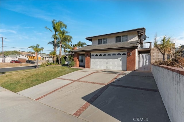 view of property featuring a garage and a front yard