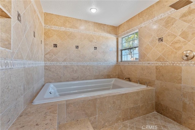 bathroom with tiled bath and tile walls