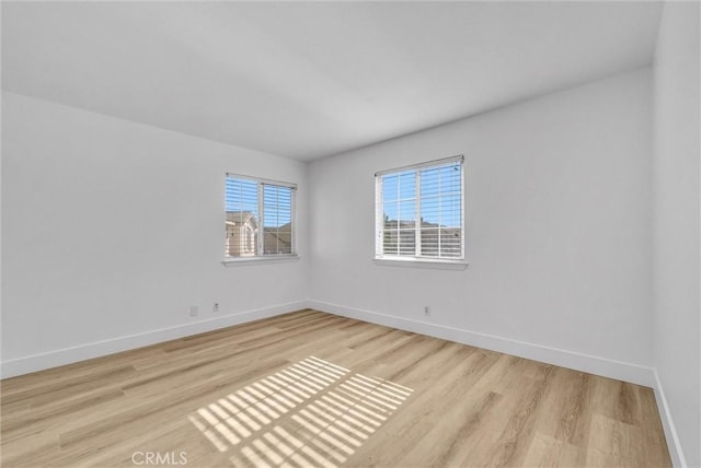 unfurnished room with light hardwood / wood-style flooring