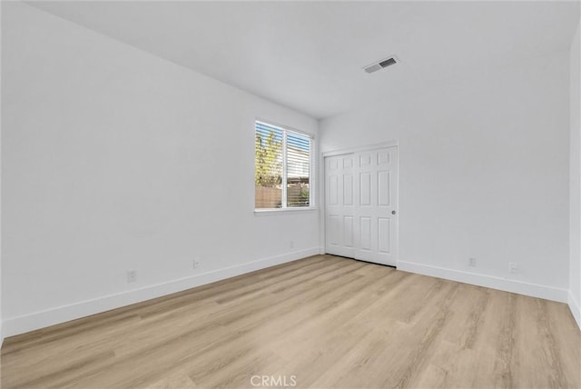 unfurnished room featuring light hardwood / wood-style floors