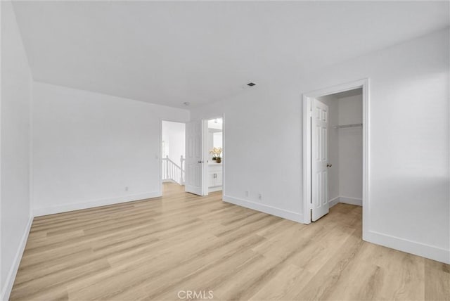 unfurnished room with light wood-type flooring