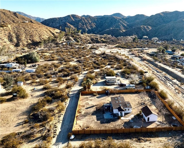 birds eye view of property featuring a mountain view