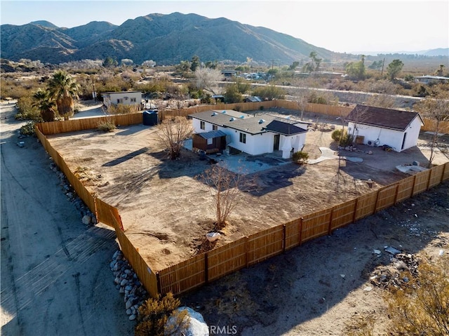 birds eye view of property with a mountain view