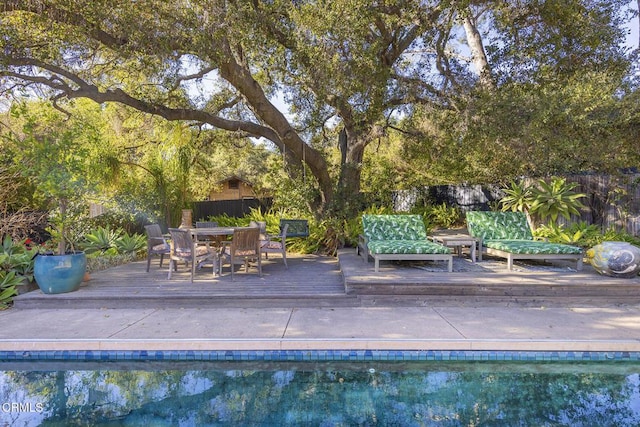 view of swimming pool with a wooden deck