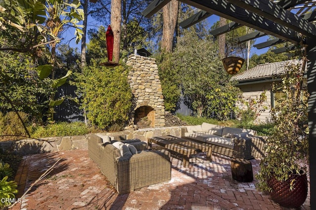 view of patio featuring a pergola and an outdoor living space with a fireplace