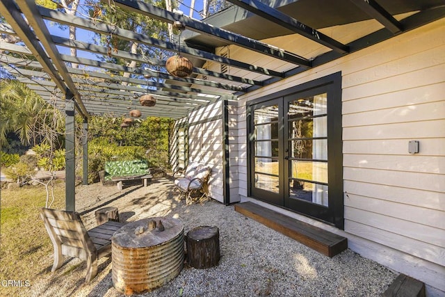 view of patio / terrace with a pergola and french doors