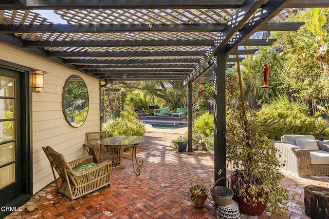 view of patio featuring an outdoor hangout area and a pergola