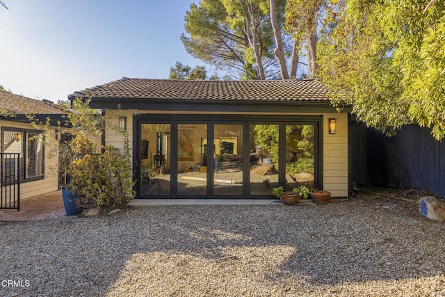 rear view of property with french doors