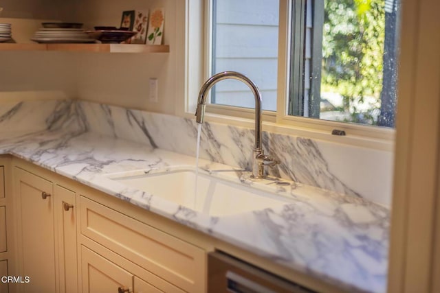 details featuring dishwashing machine and sink