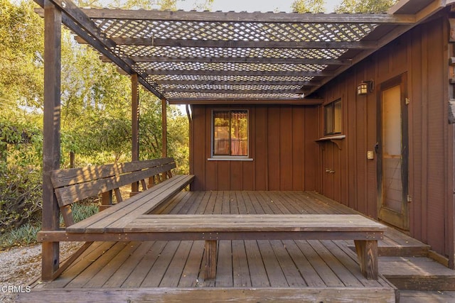 wooden terrace with a pergola