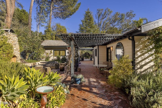 view of patio / terrace with a pergola and outdoor lounge area