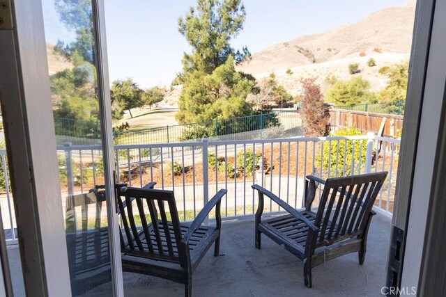 balcony featuring a mountain view