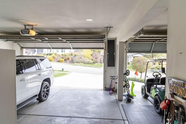 garage featuring a carport and a garage door opener