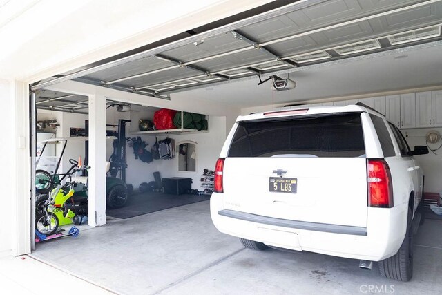 garage featuring a garage door opener