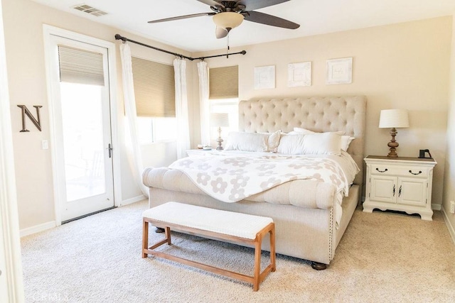bedroom with visible vents, baseboards, access to outside, a ceiling fan, and light carpet