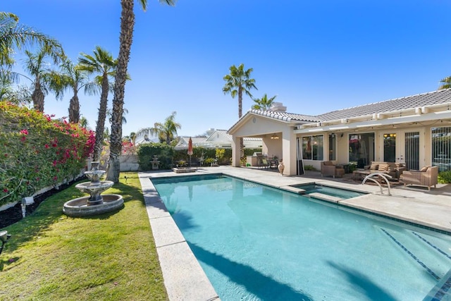 view of pool featuring a pergola, an outdoor hangout area, and a patio area