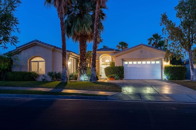 mediterranean / spanish-style home featuring a garage