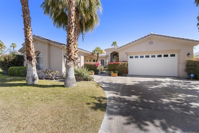 view of front of home featuring a garage and a front yard