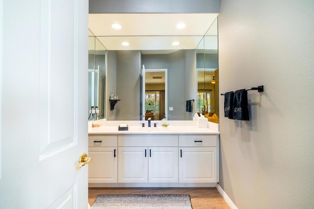 bathroom featuring vanity and hardwood / wood-style floors