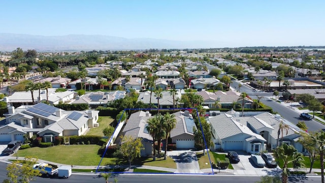 birds eye view of property featuring a mountain view