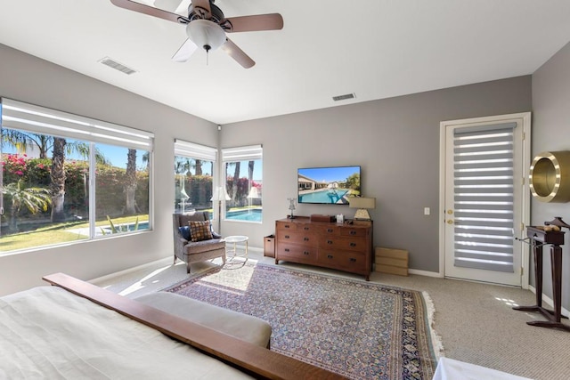 bedroom featuring ceiling fan, carpet, and access to outside