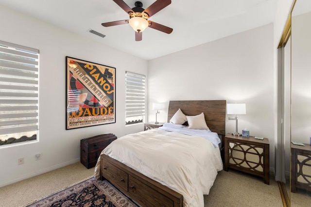 bedroom with light carpet and ceiling fan