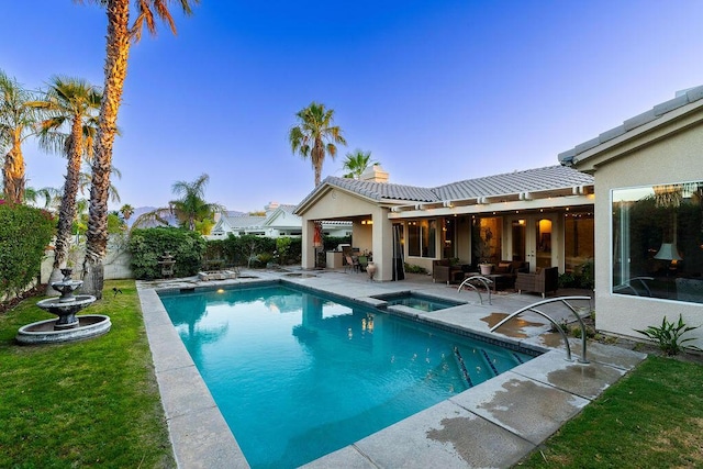 view of swimming pool with an outdoor living space, a patio, and an in ground hot tub