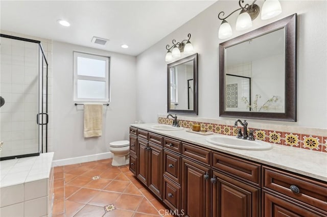 bathroom with walk in shower, tile patterned floors, vanity, and toilet