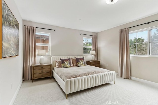 bedroom featuring light colored carpet