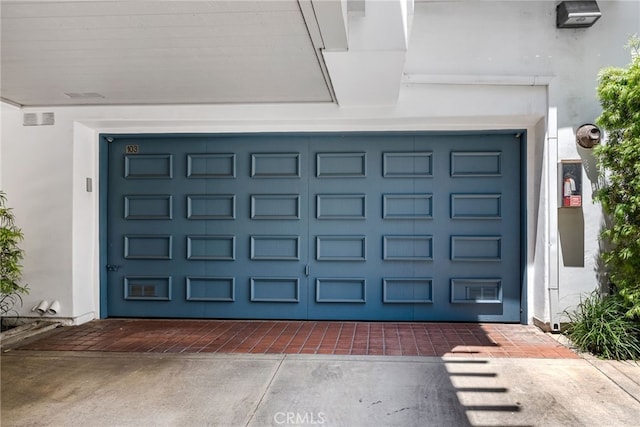 doorway to property featuring a garage