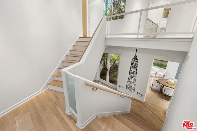 staircase featuring hardwood / wood-style flooring