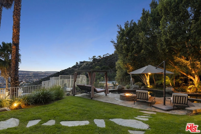 view of yard with a patio area and an outdoor fire pit