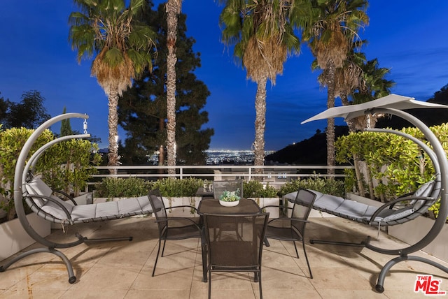 view of patio featuring a balcony