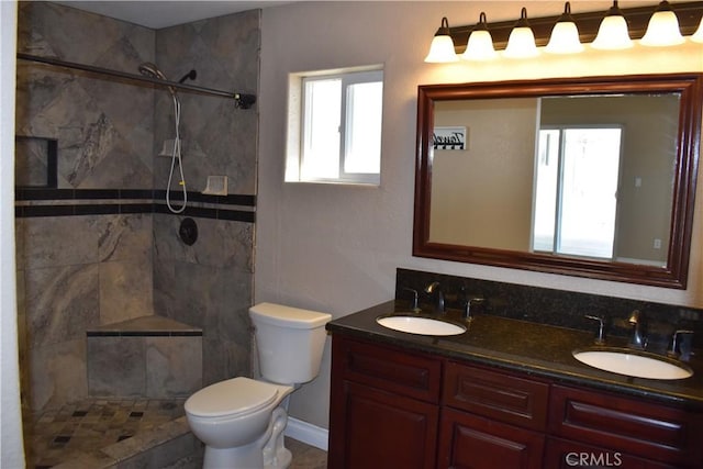 bathroom featuring a healthy amount of sunlight and a tile shower