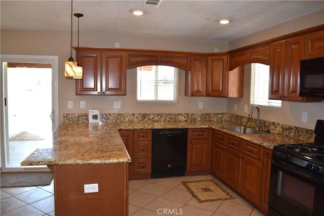 kitchen featuring sink, hanging light fixtures, kitchen peninsula, a wealth of natural light, and black appliances