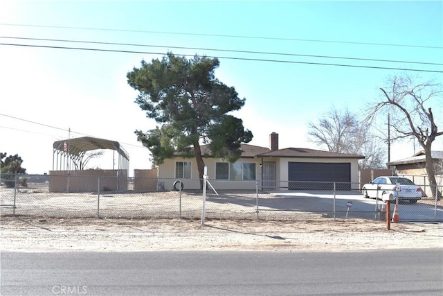 ranch-style house featuring a carport and a garage