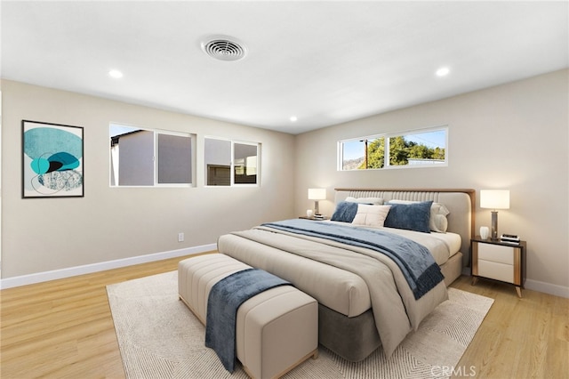 bedroom with light wood-type flooring