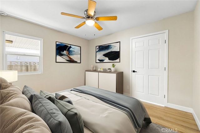 bedroom featuring hardwood / wood-style floors and ceiling fan