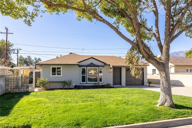 ranch-style house with a garage and a front yard