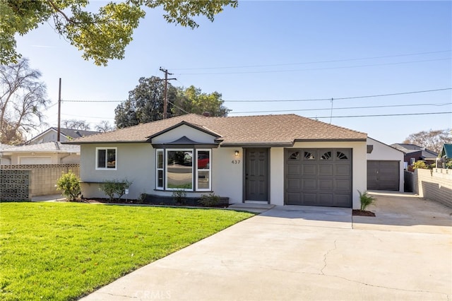 ranch-style home featuring a garage and a front yard