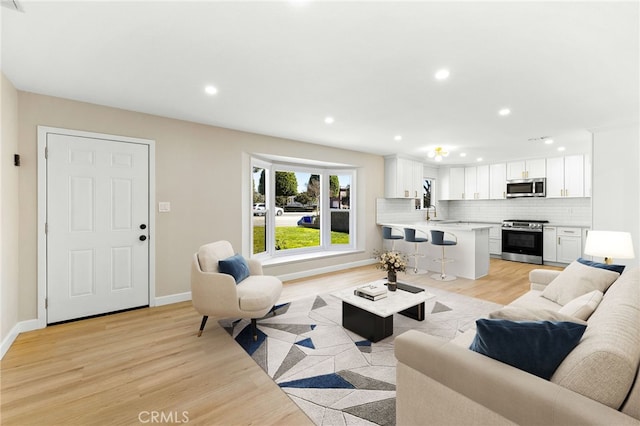 living room with light hardwood / wood-style flooring