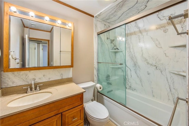 full bathroom with vanity, crown molding, enclosed tub / shower combo, and toilet