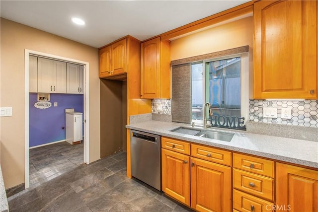 kitchen with light stone counters, sink, tasteful backsplash, and stainless steel dishwasher