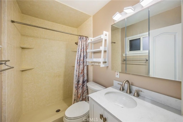 bathroom with vanity, toilet, and a shower with shower curtain