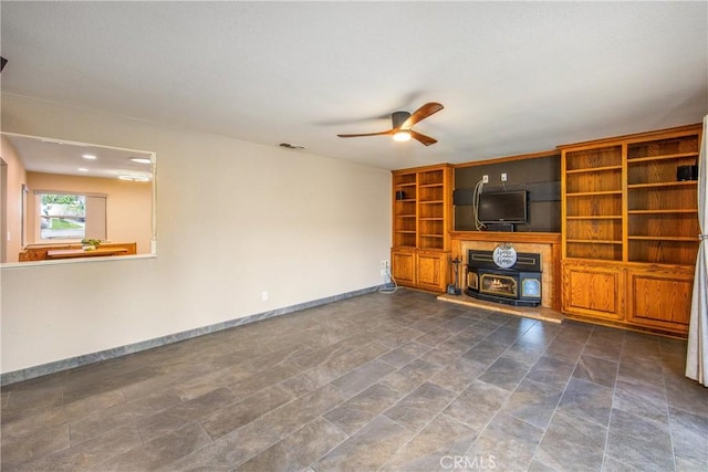 unfurnished living room featuring ceiling fan