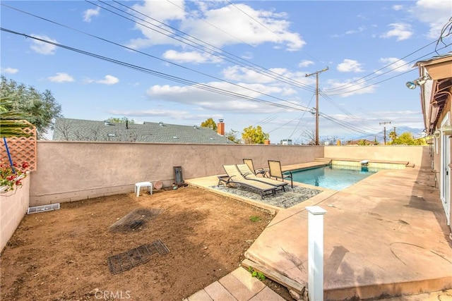 view of swimming pool featuring a patio area