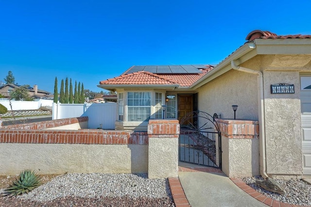 view of front of home with solar panels