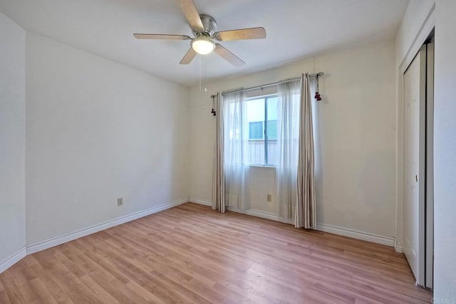 unfurnished room featuring light hardwood / wood-style floors and ceiling fan