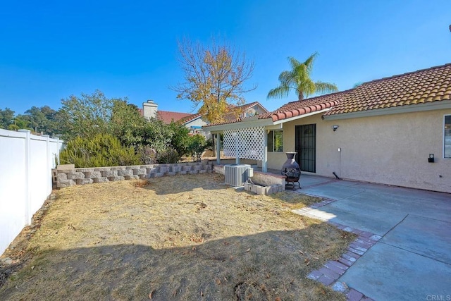 back of property featuring a patio and cooling unit