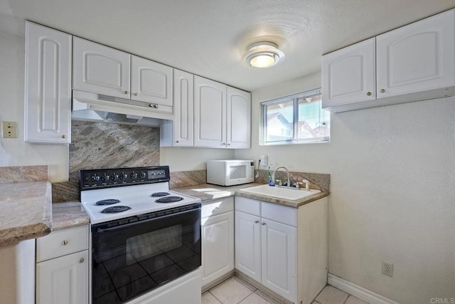 kitchen featuring sink, electric range, and white cabinets